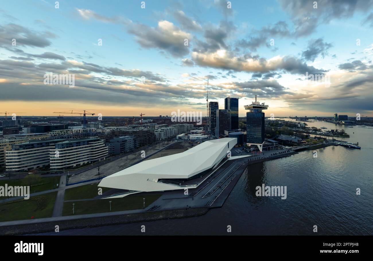 Panoramic landscape about the Amsterdam's skylines included the A'dam lookout tower and Eye Film Museum too. the buildings are reflected on the water. Stock Photo