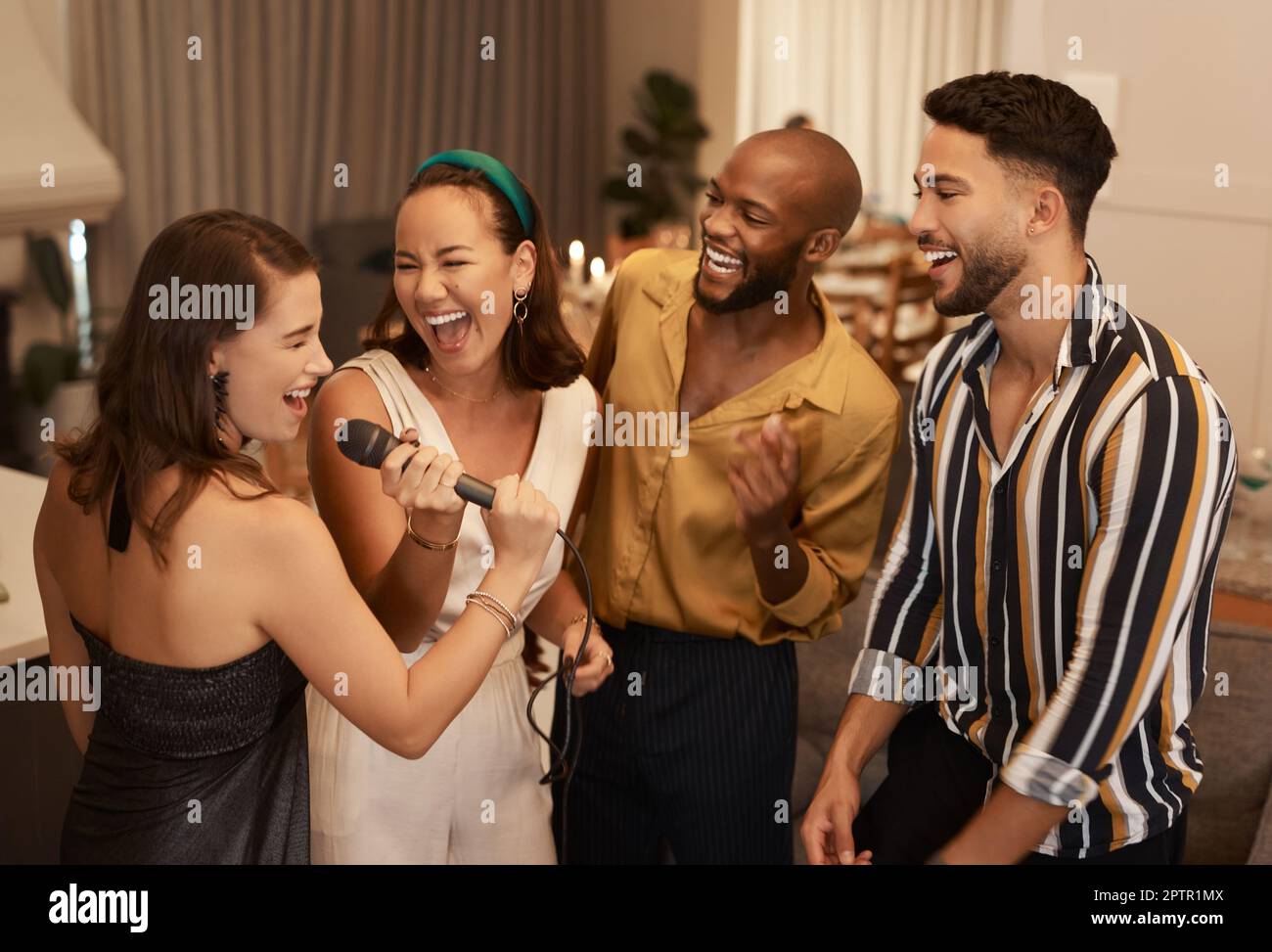 Friends, karaoke party and happy celebration together, dancing and fun reunion in restaurant