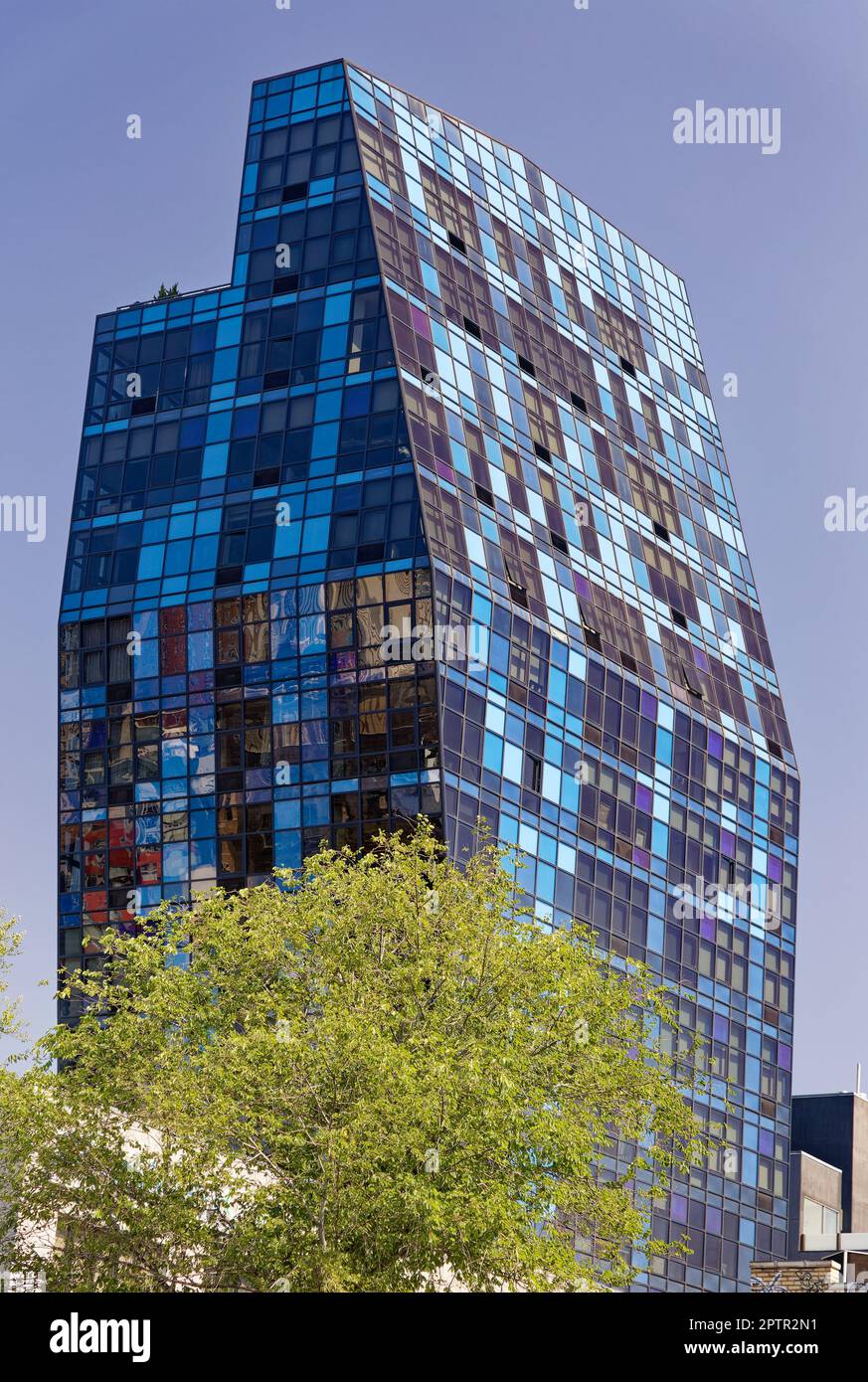 Blue is two buildings: The taller, oddly cantilevered 103 Norfolk Street is on a commercial-zone lot, joined to residential-zoned 105 Norfolk Street. Stock Photo