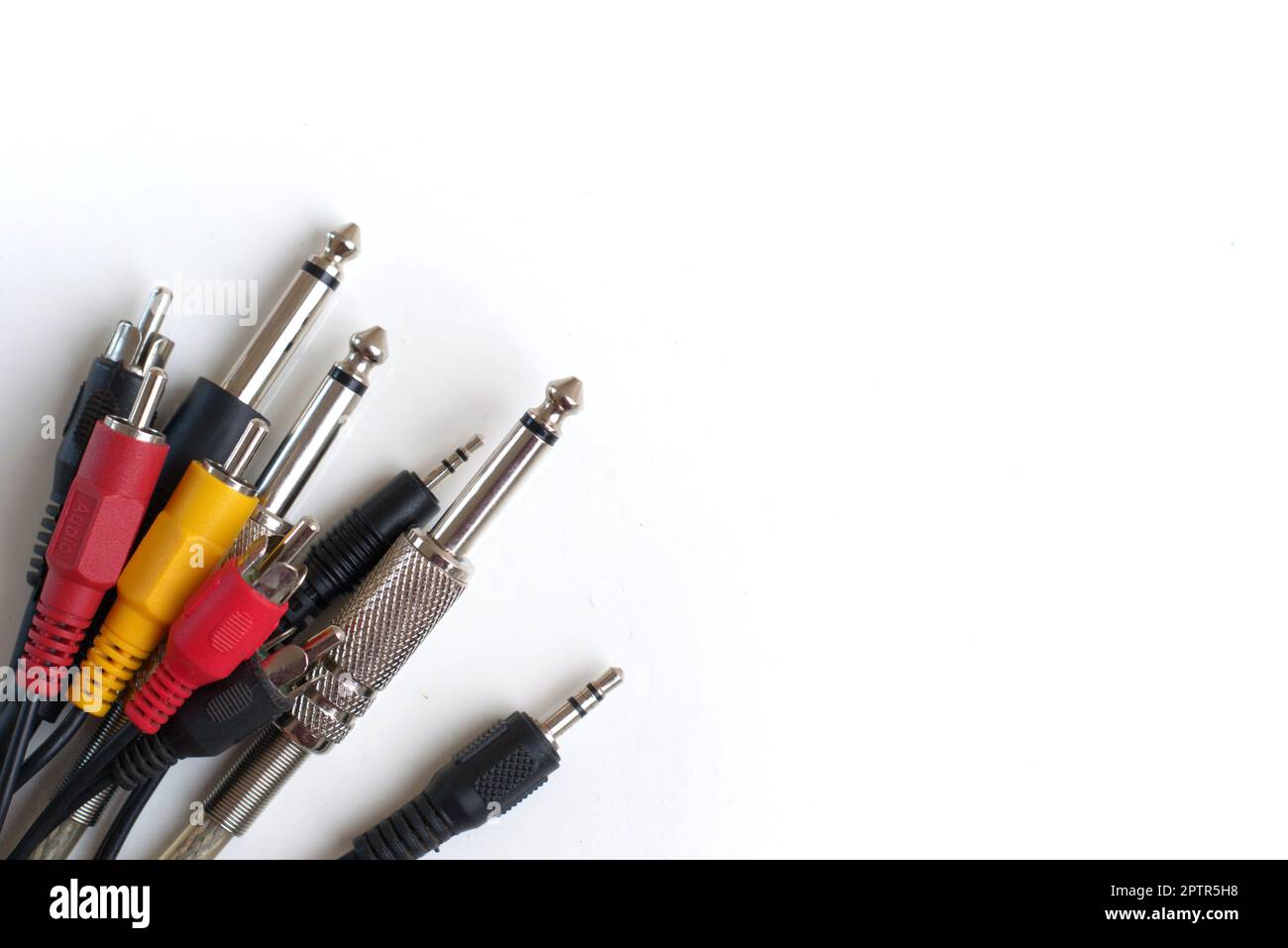 Audio cables and connectors on white background. Recording studio