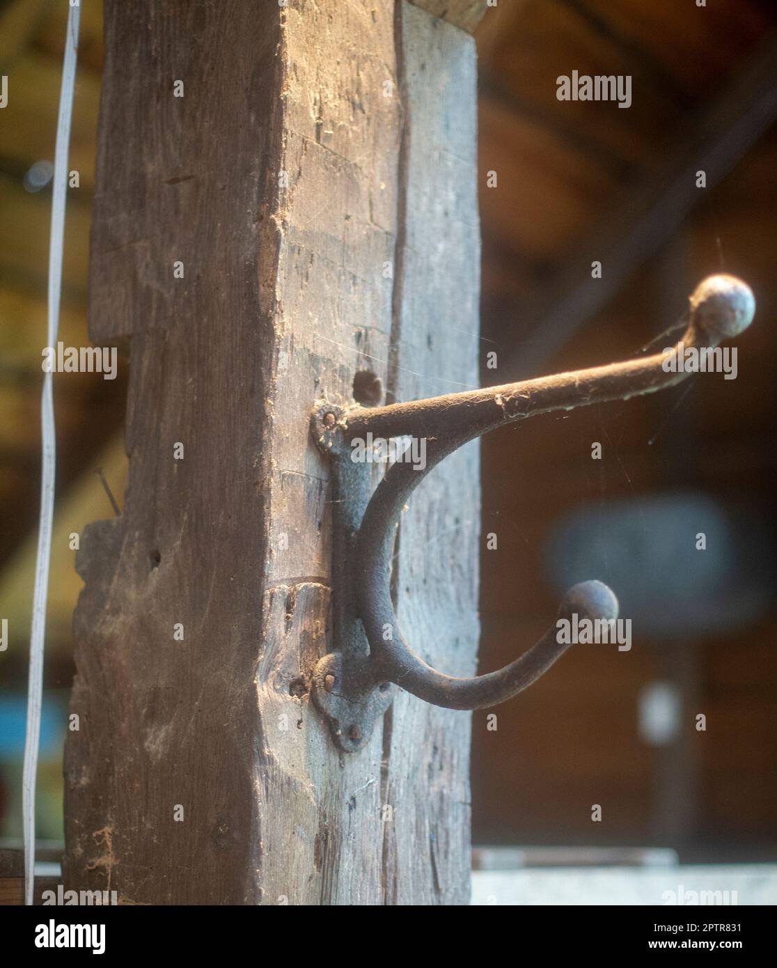 An old coat hook in a barn Stock Photo