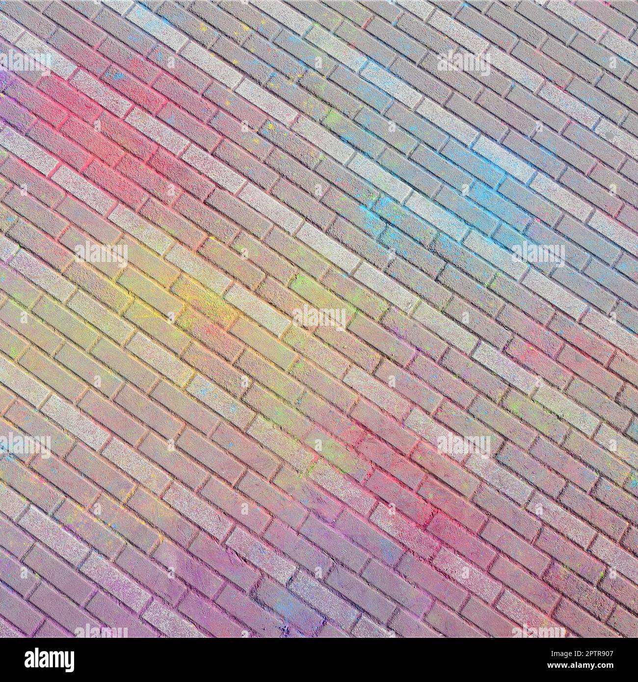 Multi colored earth, paving slabs, powder coated with dry colors at the