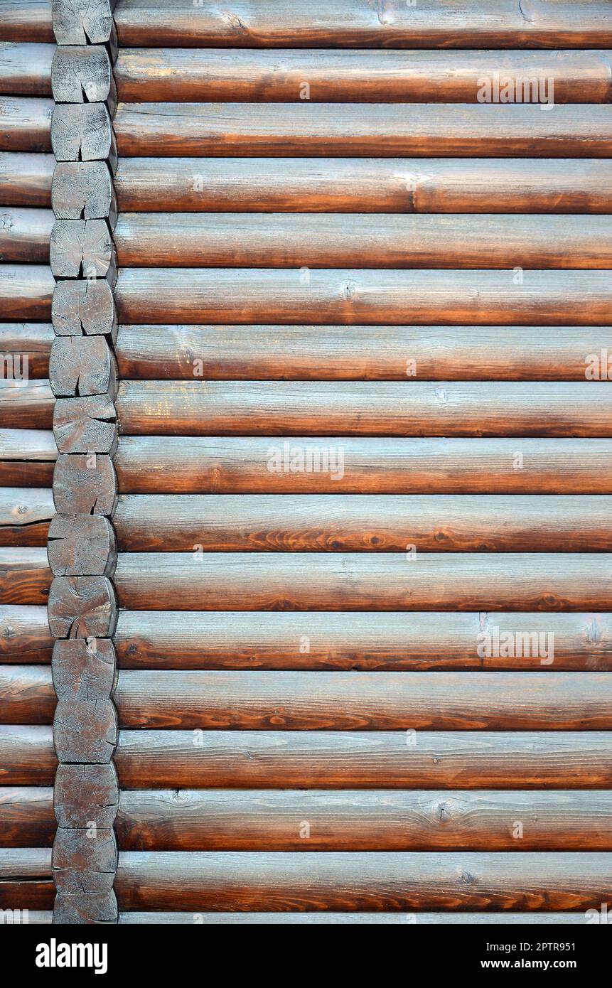 Hewn timber. Rustic log wall horizontal timber background. Fragment of