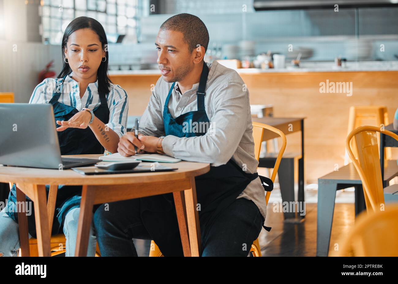 Cafe store owners planning budget, brainstorming coffee shop innovation