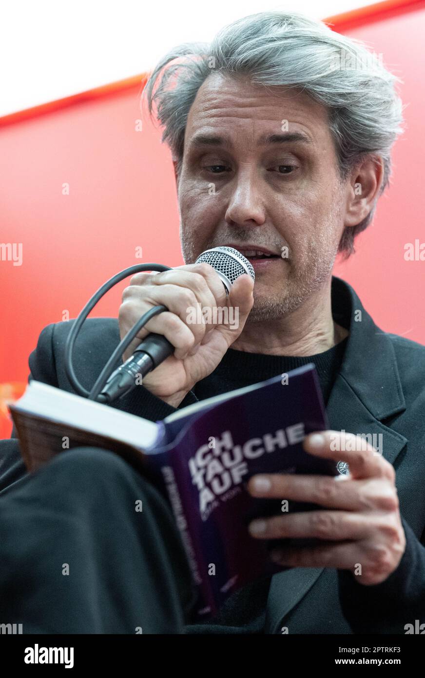 Leipzig, Germany. 28th Apr, 2023. The German musician and frontman of the band Tocotronic, Dirk von Lowtzow, presents his book "Ich tauche auf" (Kiepenheuer&Witsch) at the Leipzig Book Fair at the taz stand. At the spring meeting of the book industry, around 2000 exhibitors from 40 countries present their book-related innovations. Austria will be the guest country at the book fair. Credit: Hendrik Schmidt/dpa/Alamy Live News Stock Photo