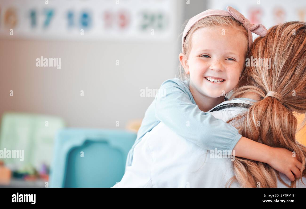 Child psychology at work. Adorable little girl hugging her female