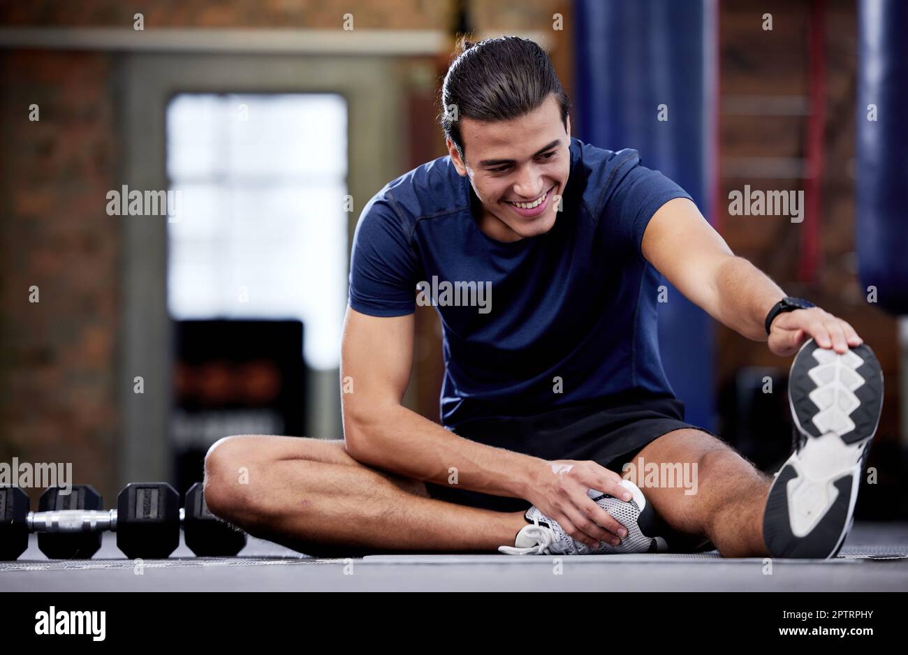 Man stretching floor legs hi-res stock photography and images - Alamy