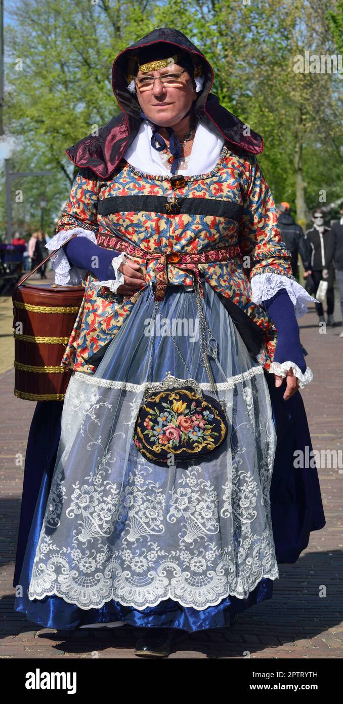 Woman in  traditional dutch costume at the open-air museum at Zaanse Schans a neighborhood in the Dutch town of Zaandam, Netherlands Stock Photo