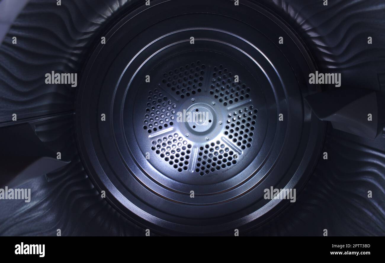 View from inside the clean empty drum of a washing machine Stock Photo