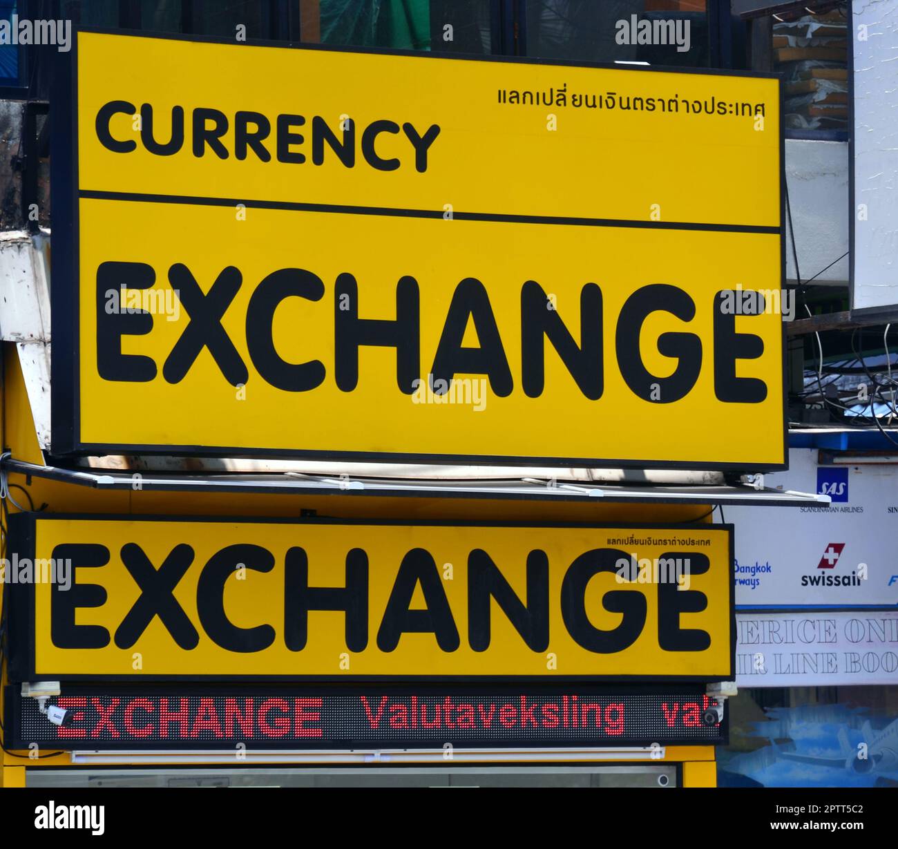 Sign on a foreign exchange or currency exchange booth or shop where people can change currencies in Thailand, Asia. Stock Photo