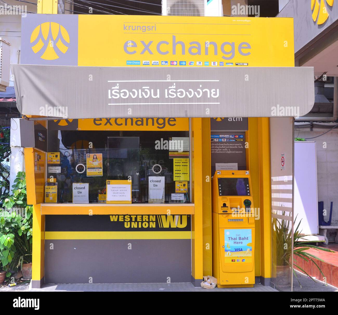 A foreign exchange or currency exchange booth or shop, operated by Krungsri Bank, where people can change currencies in Thailand, Asia. Stock Photo