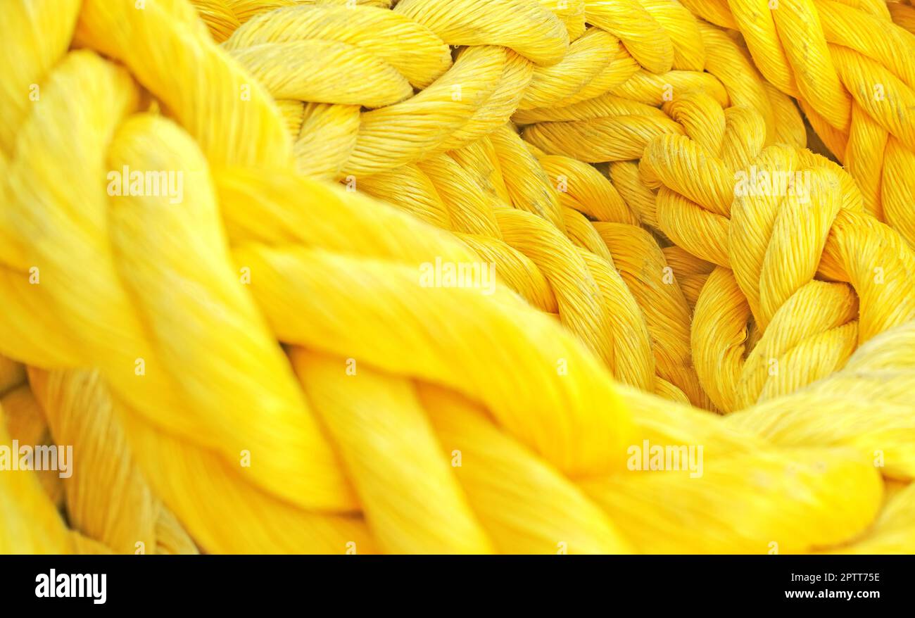 Strong thick braided colorful rope woven and twined. Yellow thick rope  macro closeup laying in a heap. Long twisted strong material symbolizes  unity Stock Photo - Alamy, twisted colorful rope 