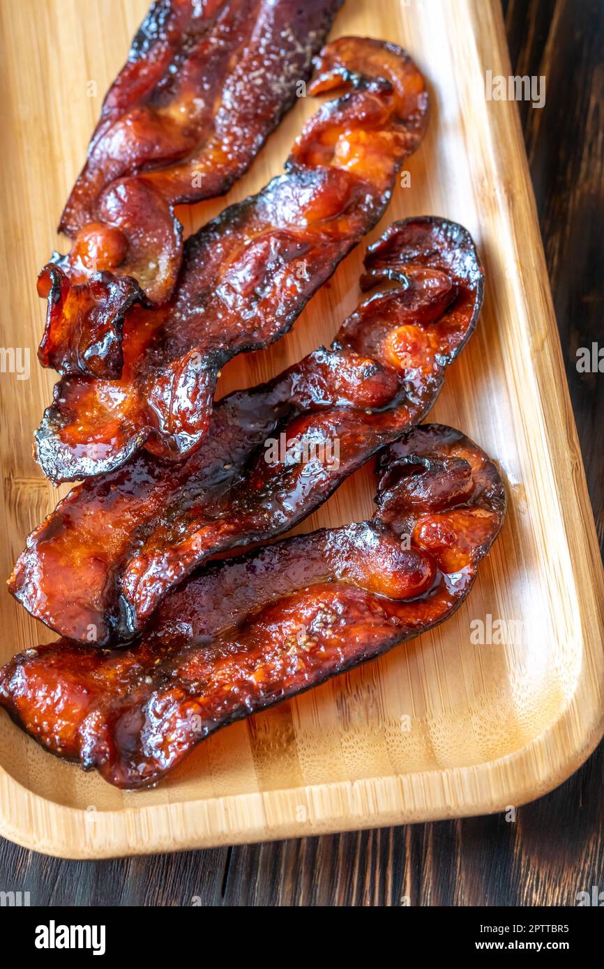 Fried bacon strips glazed in brown sugar Stock Photo Alamy