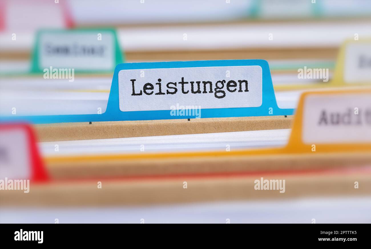 File folders with a tab labeled Services in german - Leistungen Stock Photo