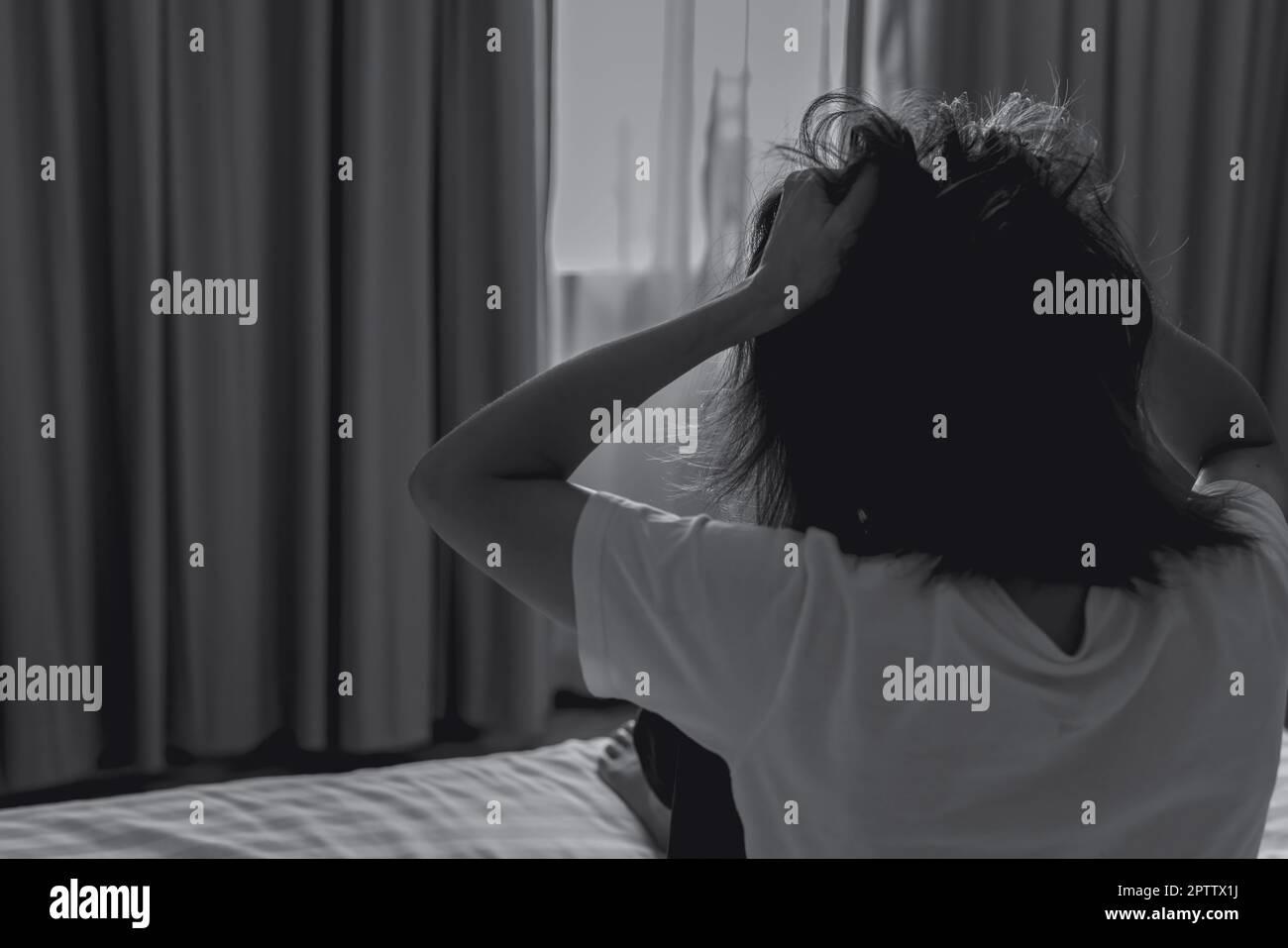 World Mental Health Day concept. Rear view of angry woman put hand on