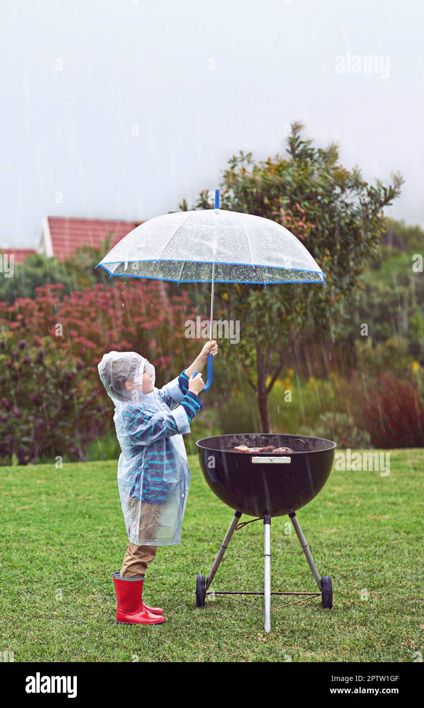 Nevermind the rain, Im hungry. Full length shot of a young boy standing