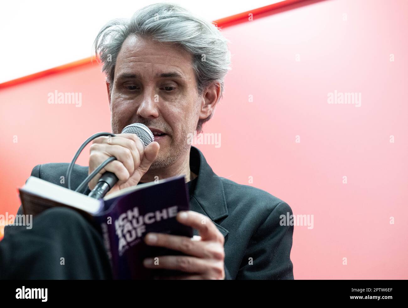 Leipzig, Germany. 28th Apr, 2023. The German musician and frontman of the band Tocotronic, Dirk von Lowtzow, presents his book 'Ich tauche auf' (Kiepenheuer&Witsch) at the Leipzig Book Fair at the taz stand. At the spring meeting of the book industry, around 2000 exhibitors from 40 countries present their book-related innovations. Austria will be the guest country at the book fair. Credit: Hendrik Schmidt/dpa/Alamy Live News Stock Photo