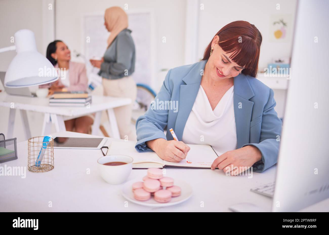 Business, woman and writing in book while on tea break with snacks in ...