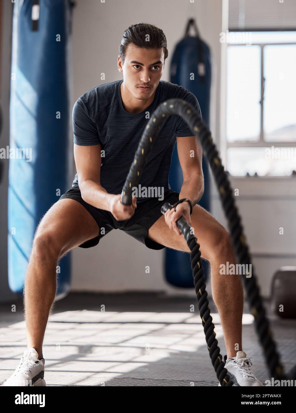 Fitness, man and rope exercise, training and workout, muscle, energy
