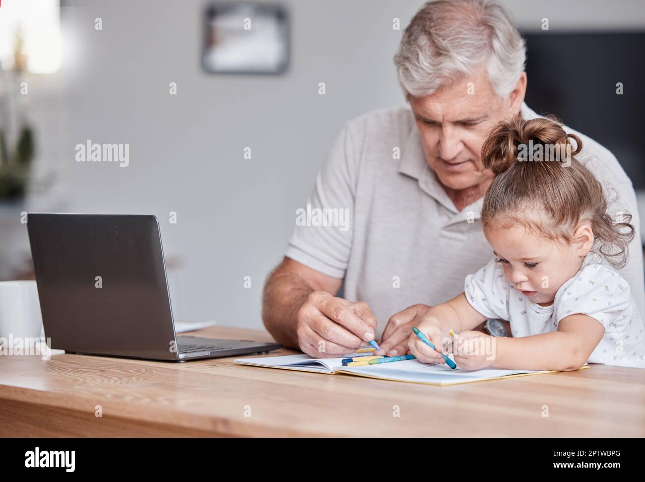 Drawing, color and grandfather with girl in home writing, bonding and doing fun art activity together. Family, love and grandpa sitting at table with Stock Photo