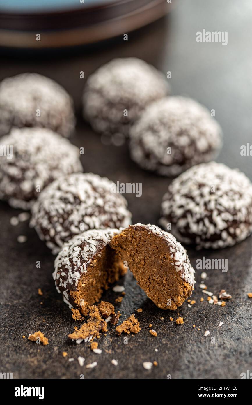 Coconut chocolate balls on the kitchen table. Stock Photo