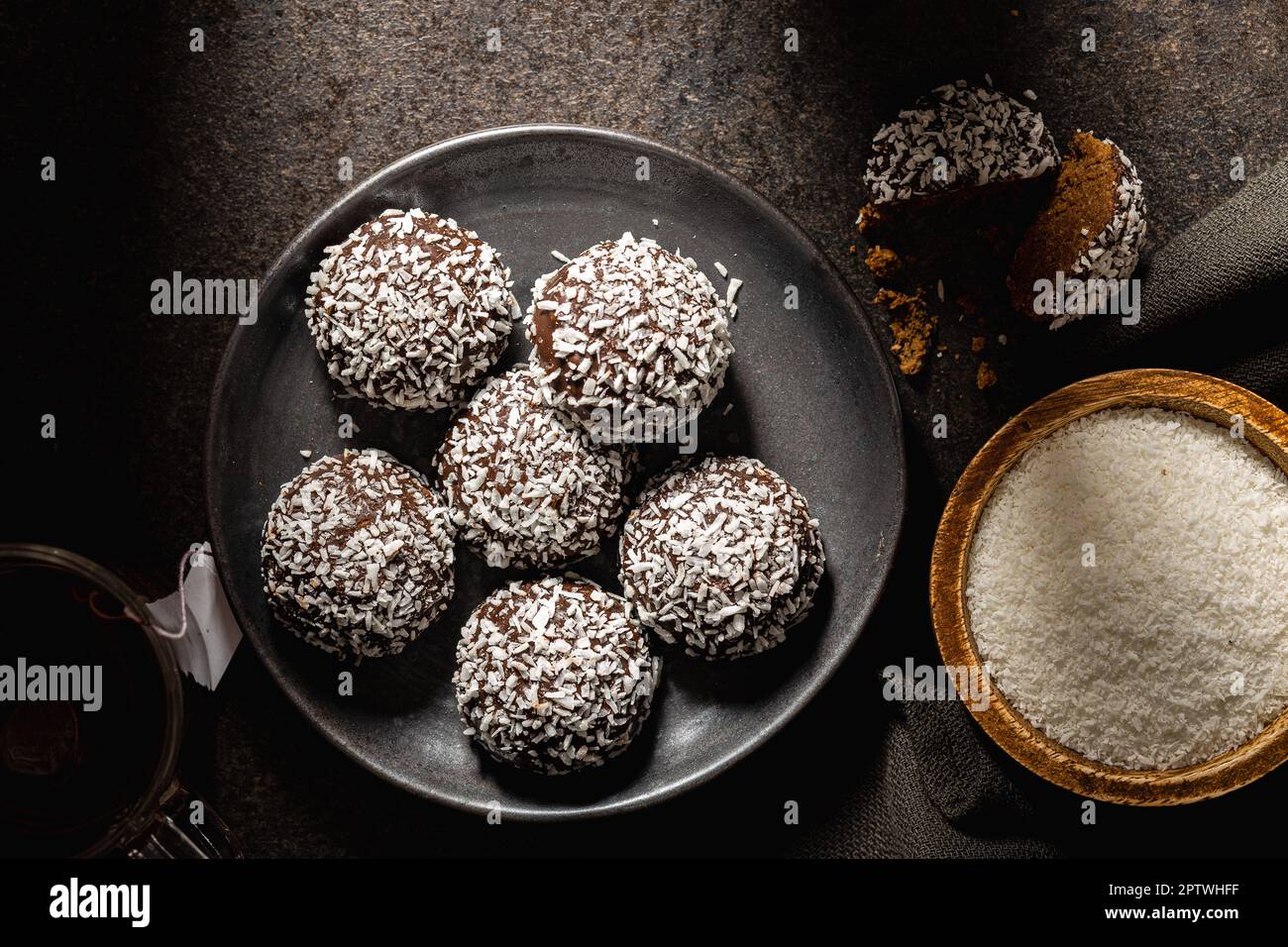 Coconut chocolate balls on the plate. Top view. Stock Photo