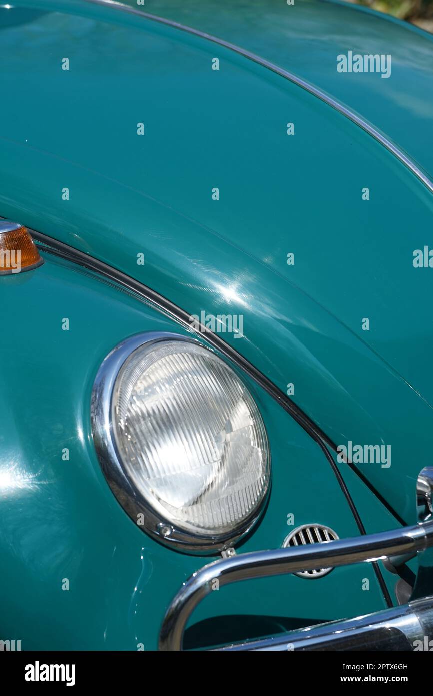 a old car in green called käfer ,Volkswagen Stock Photo