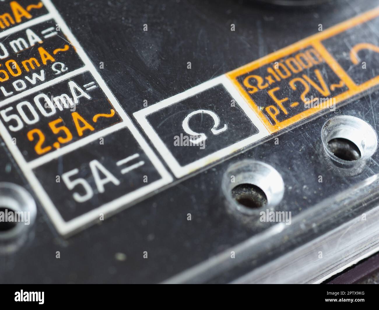 electrical symbols on a vintage analog multimeter measuring instrument