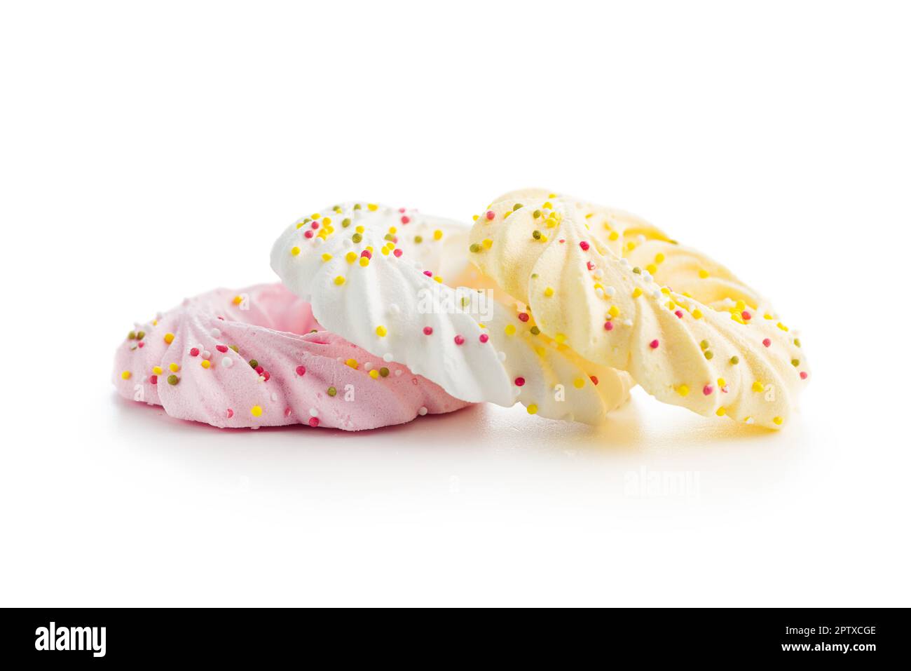 Different colors meringues with sprinkles isolated on the white ...