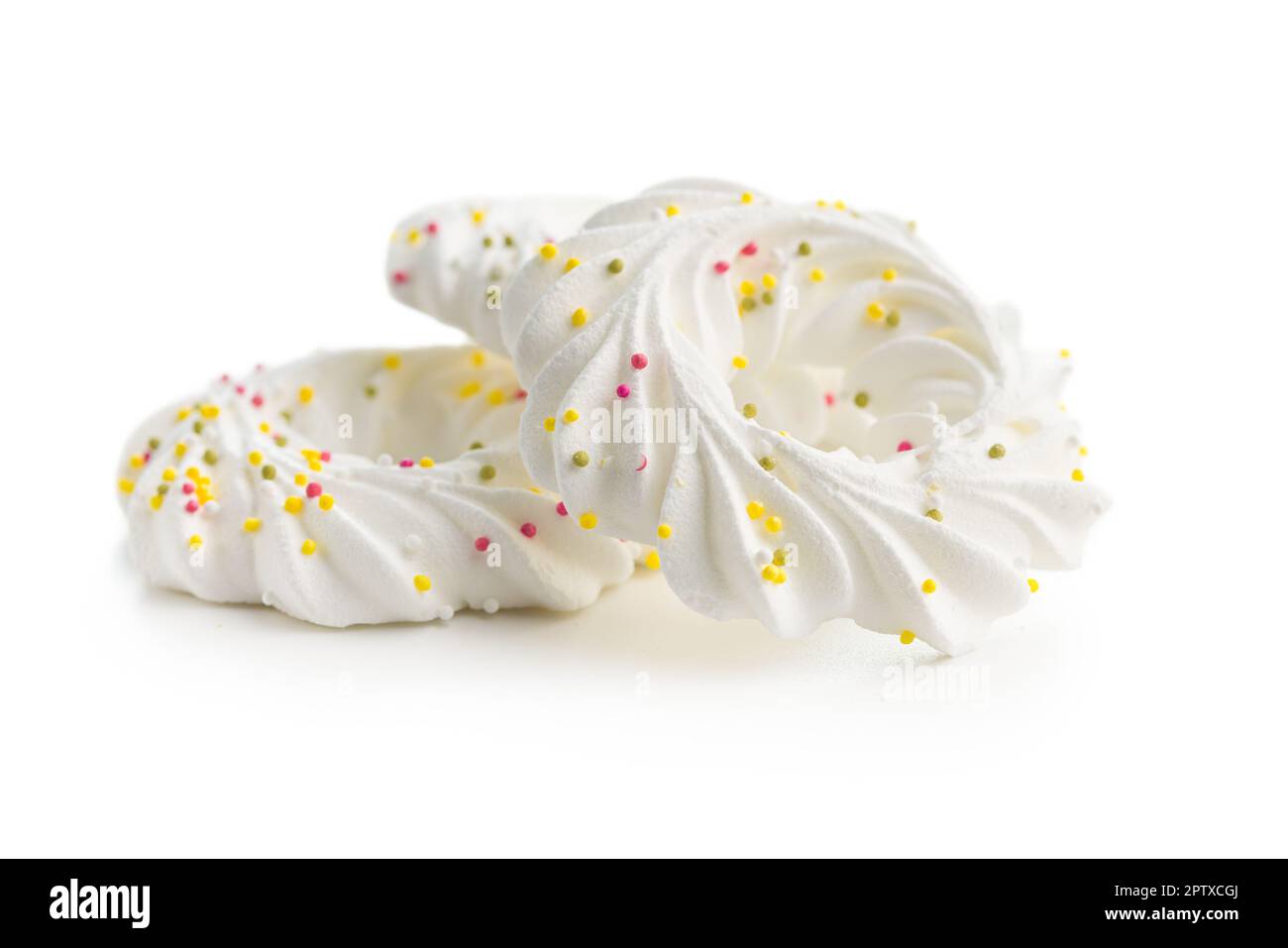 Sweet meringues with sprinkles isolated on the white background Stock ...