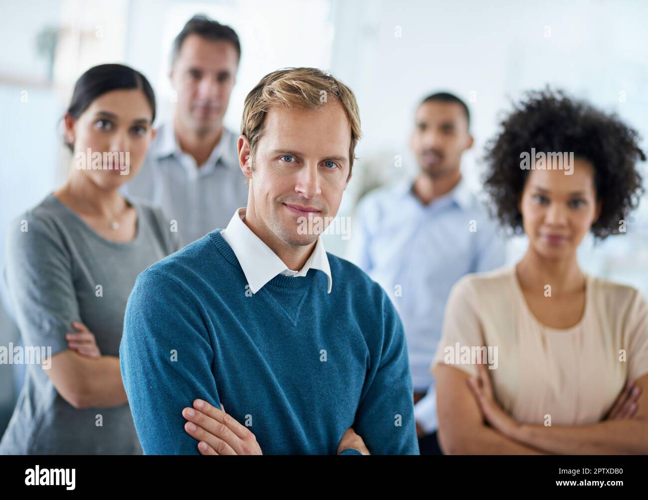 We set goals and achieve them. Portrait of a group of diverse colleagues standing in an office Stock Photo