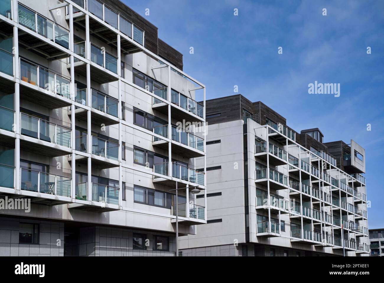 Street with modern low-rise apartment building Stock Photo