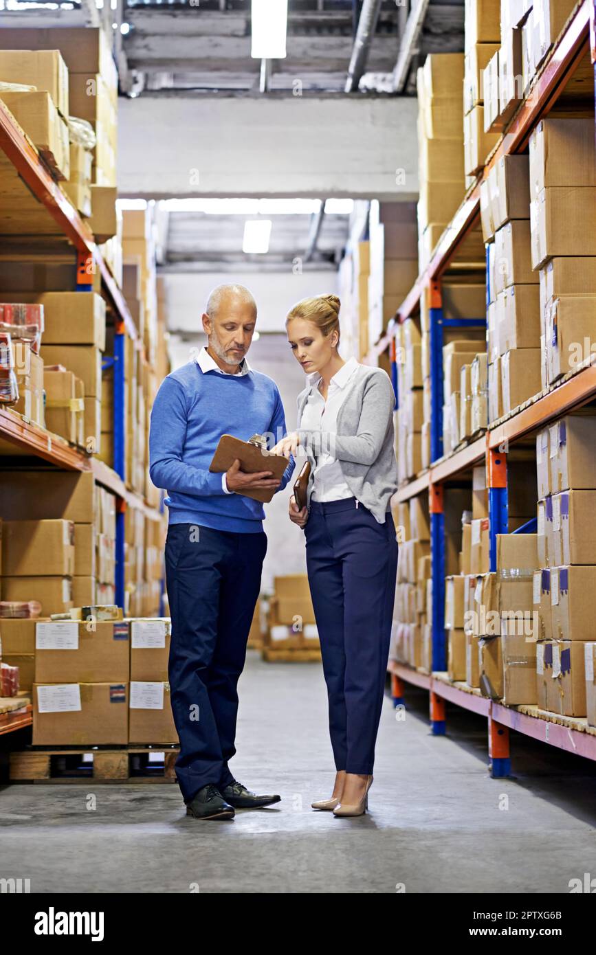 Someone Inspecting Inventory Inspecting boxes hi-res stock photography and images - Alamy