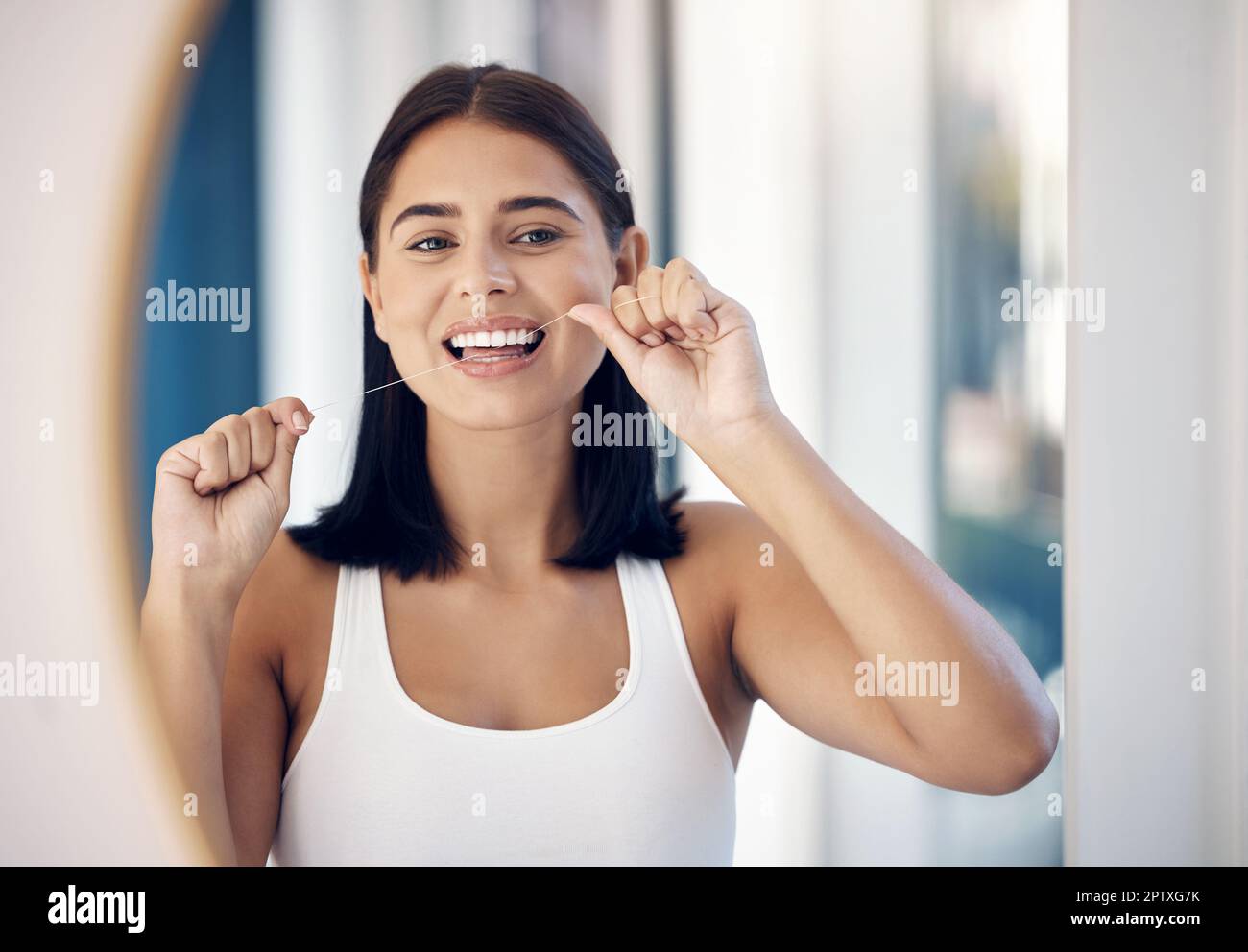 Dental floss, teeth and woman in mirror of bathroom for oral hygiene