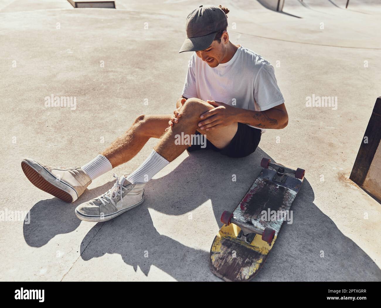 Skateboard, knee and injury with a sports man holding his leg joint in pain  after a fall or accident outdoor. Fitness, skatepark and exercise with a m  Stock Photo - Alamy