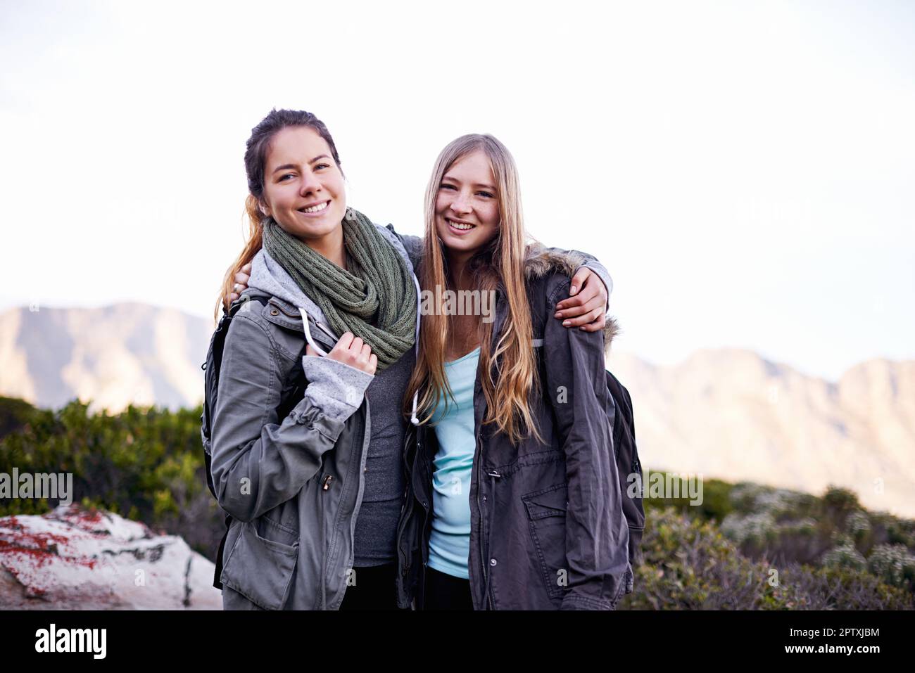 We made it together. Portrait of two attractive young female hikers in ...