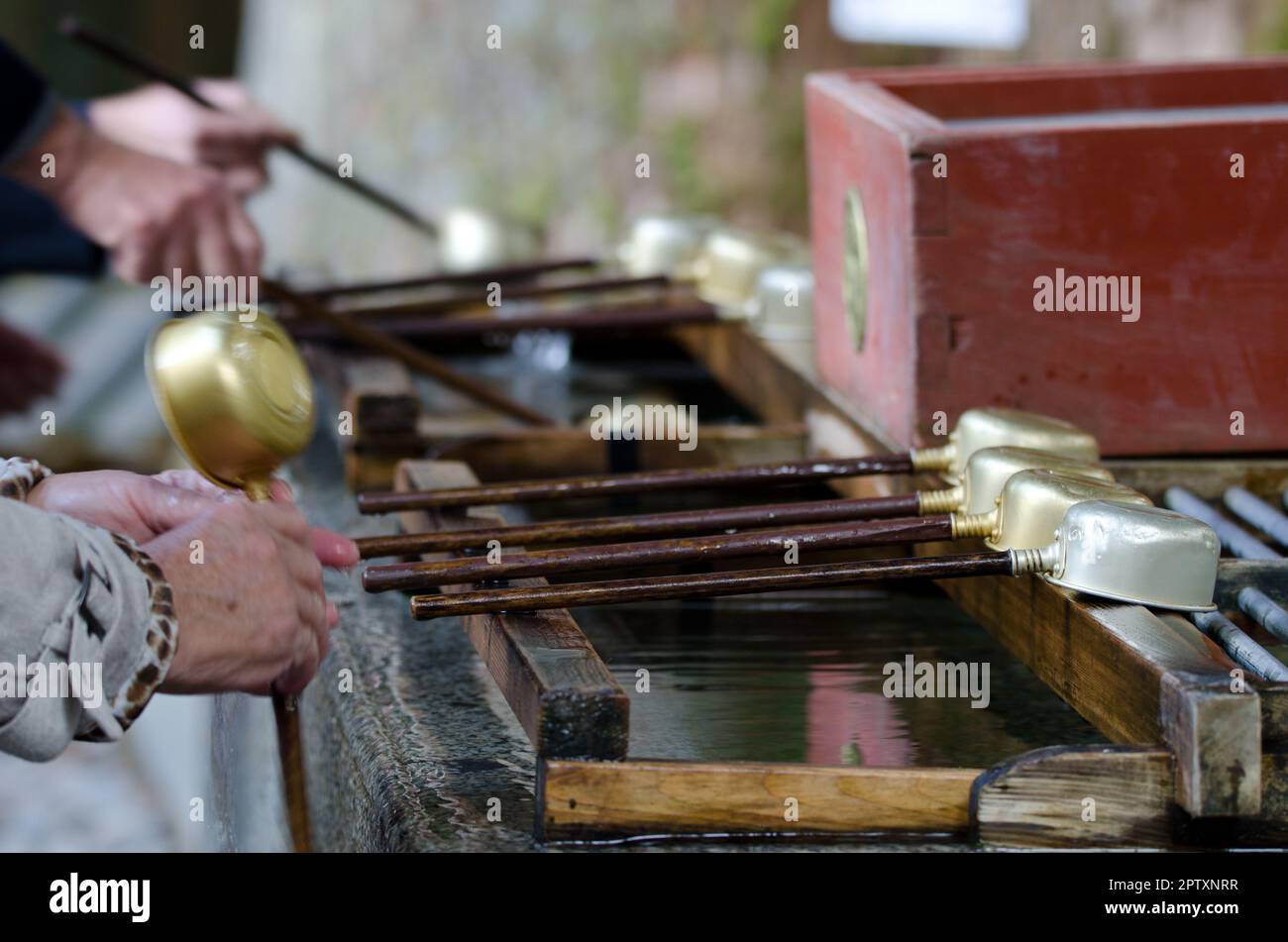People performing ablutions, ceremonial purification rite known as ...