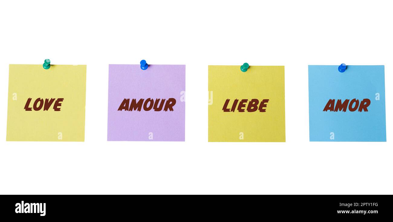 some colorful cards with the word love written on it in English, French, German and Spanish languages Stock Photo