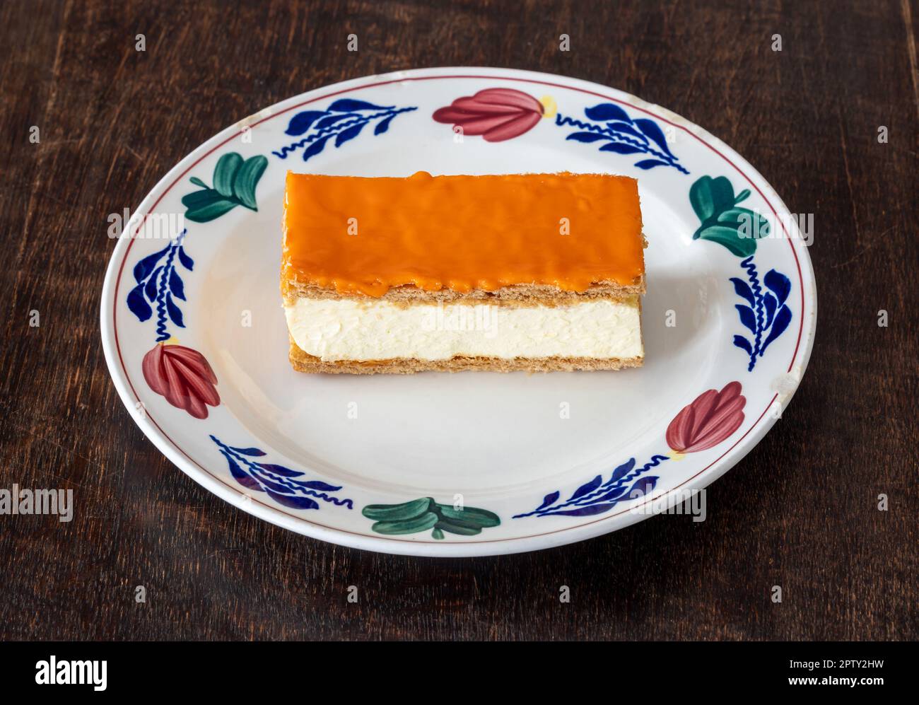 Orange variant of dutch pastry Tompouce available typically only around King's Day, a national holiday celebrating the birthday of the king Stock Photo