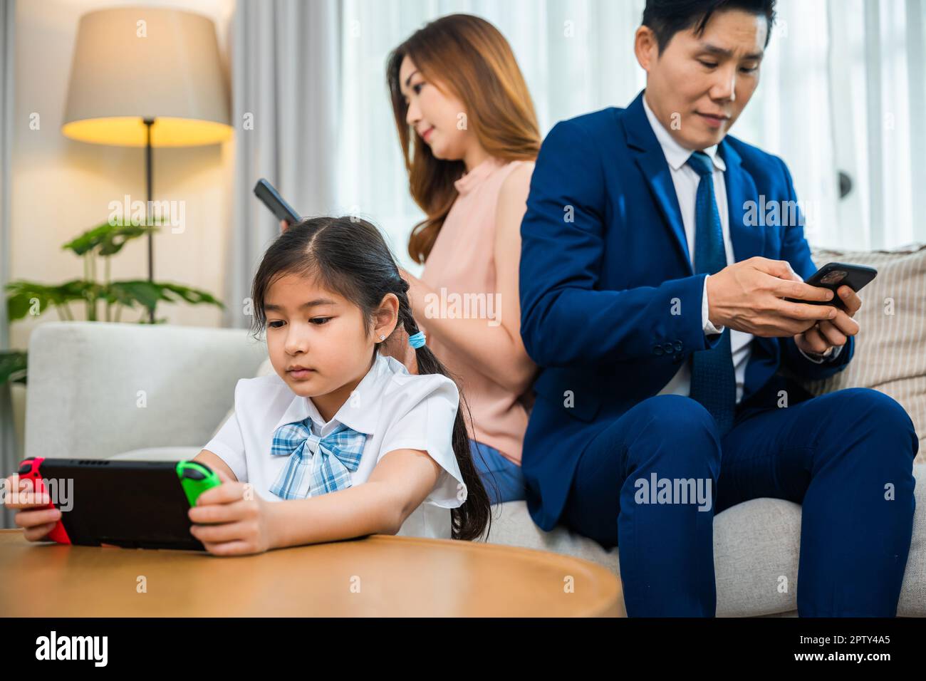 Asian family gadgets Stock Photos, Royalty Free Asian family gadgets Images