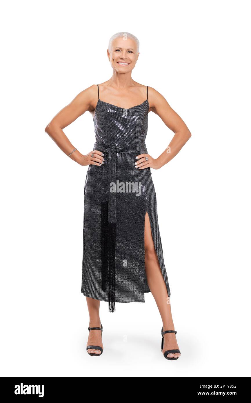 Full length portrait of smiling middleaged woman in cocktail dress
