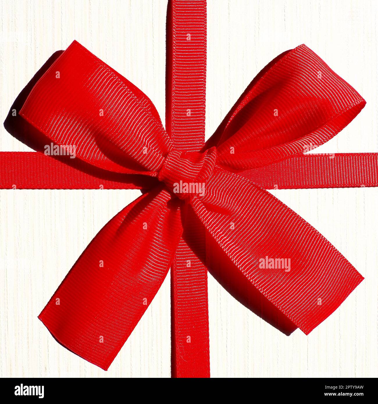 White gift box with red ribbon bow isolated on white background Stock ...