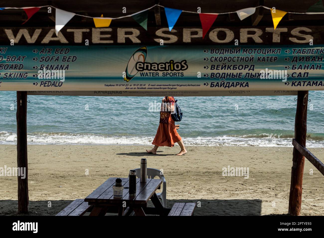 April 28, 2023, Limassol, Limassol, Cyprus A woman walks in front of a