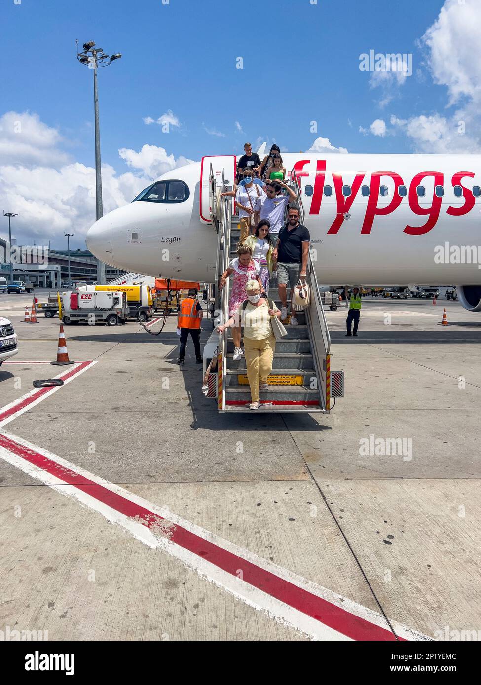 Istanbul, Turkey, 07.21.2022; Passengers disembark from the aircraft Pegasus Airways at Sabiha Gokcen airport. Summer travel destination concept Stock Photo