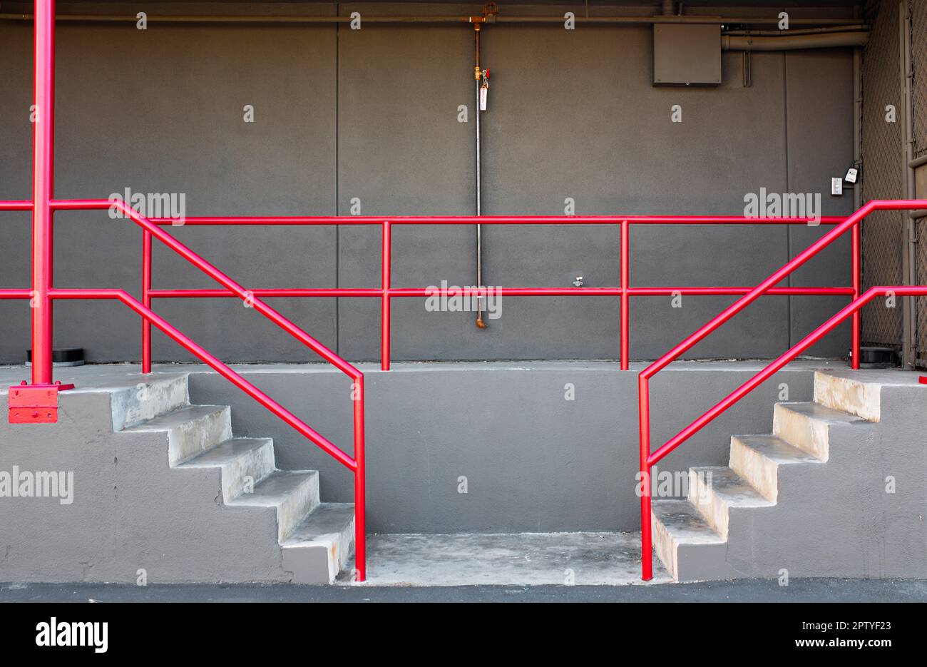 Loading Dock with Red Hand and Barrier Rails Stock Photo