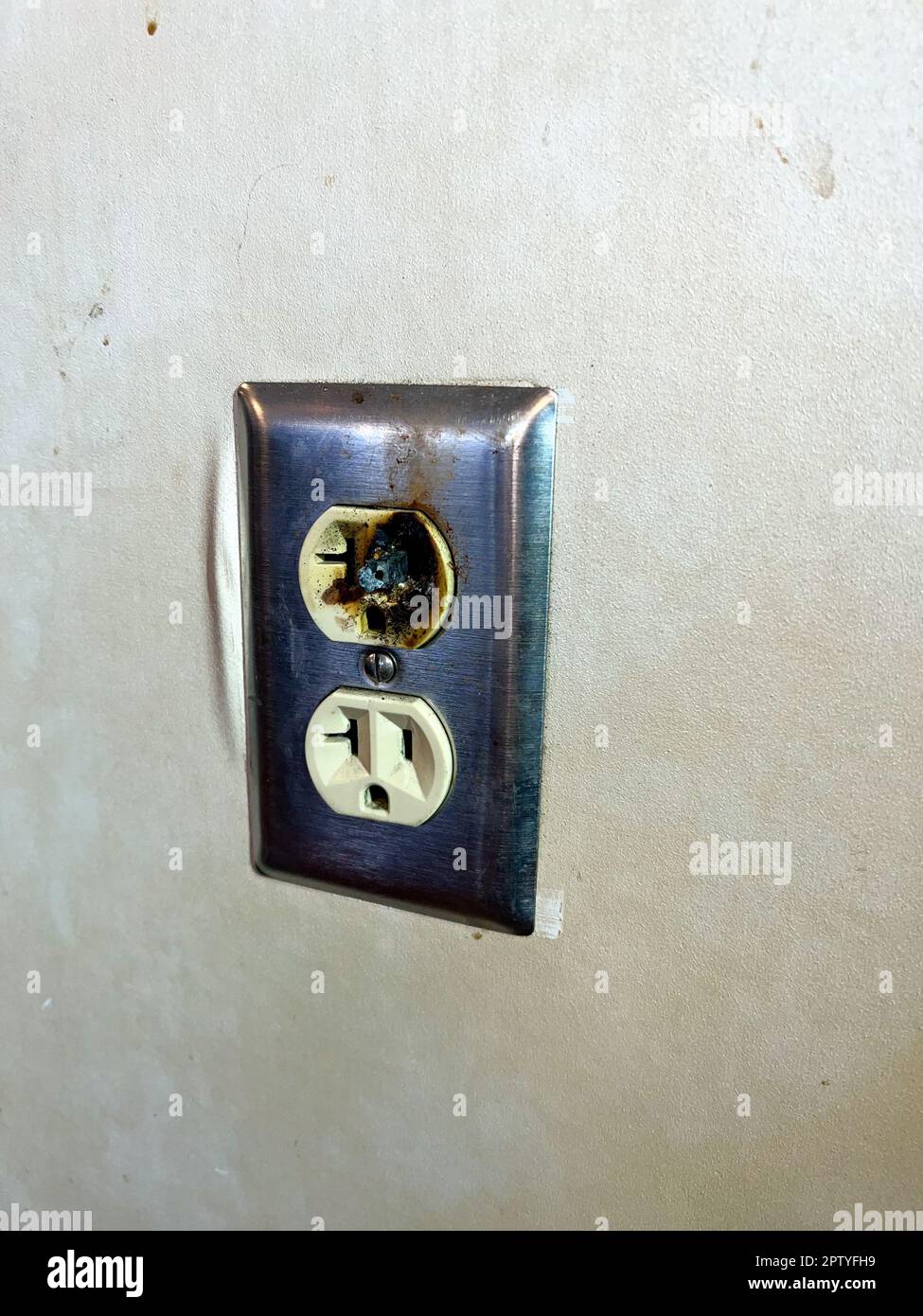 Close up of faulty dangerous electrical outlet that needs to be