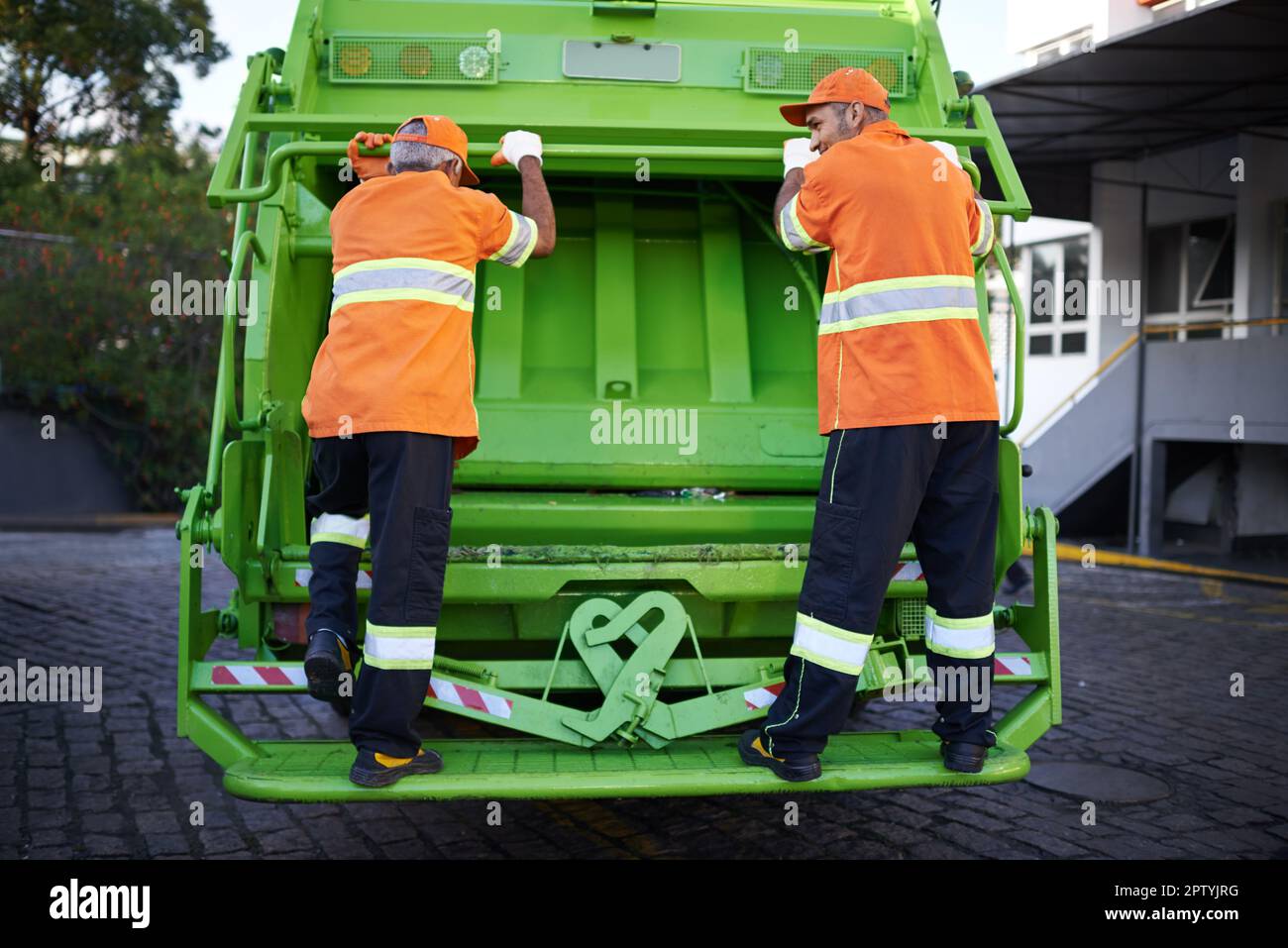 Garbage collection day. a garbage collection team at work Stock Photo