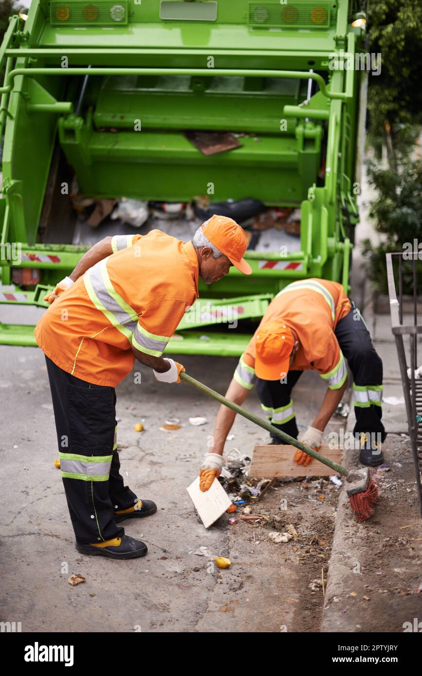 Garbage collection day. a garbage collection team at work Stock Photo