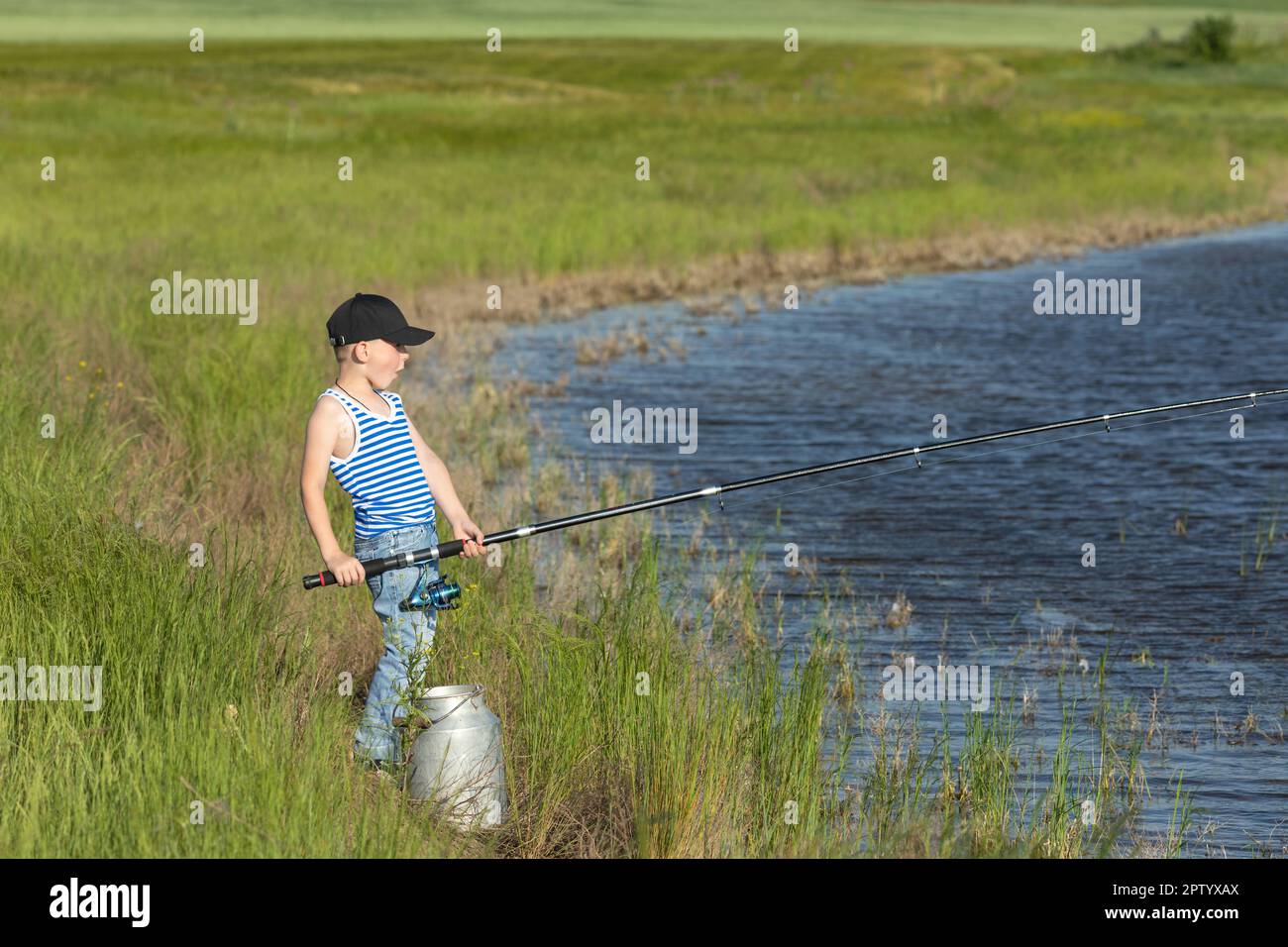 Boy catching fish fishing net hi-res stock photography and images - Alamy