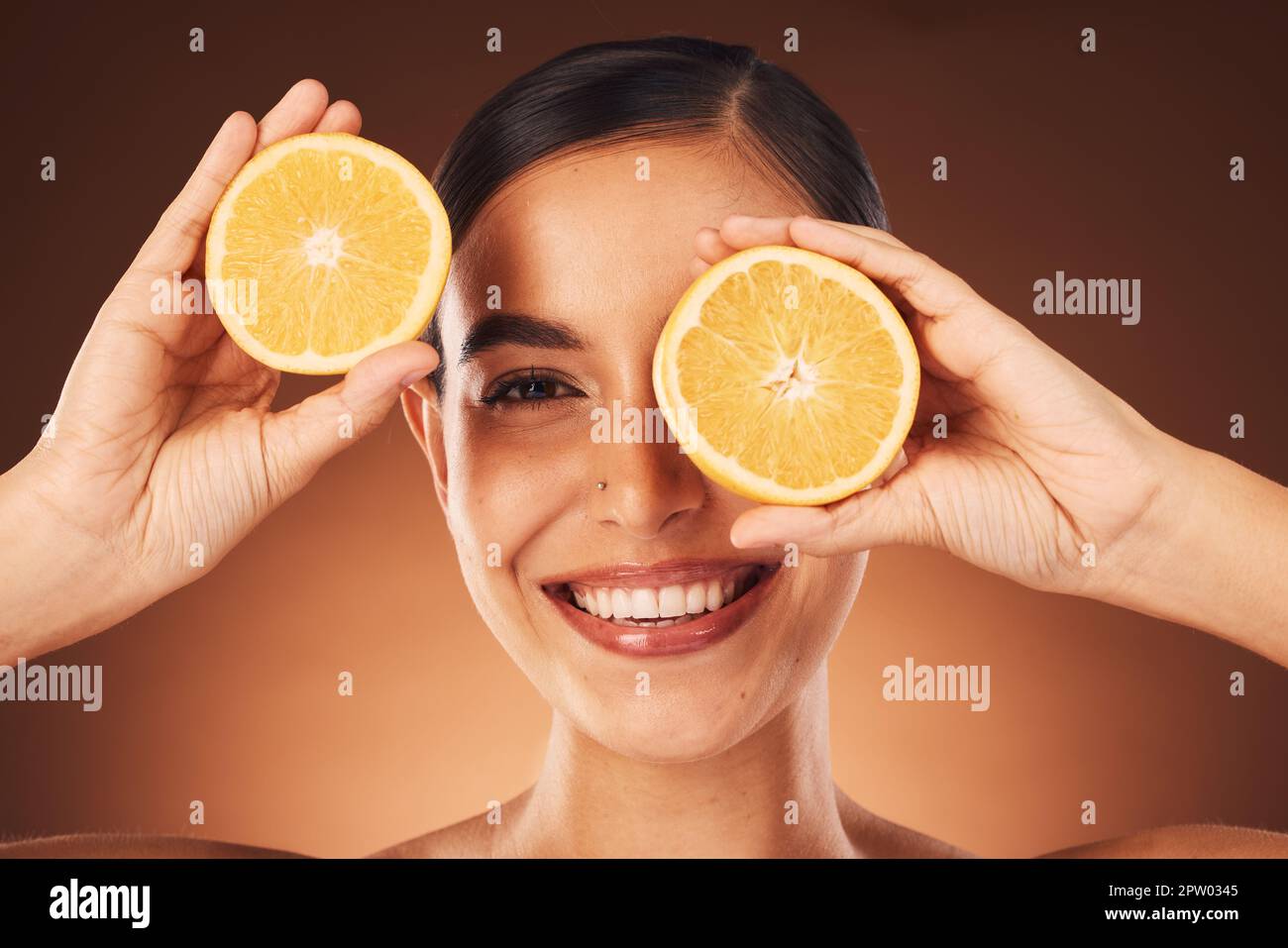 Skincare, woman and portrait with orange face for vitamin c, aesthetic and cosmetic treatment zoom. Health, wellness and self love model with smile fo Stock Photo - Alamy